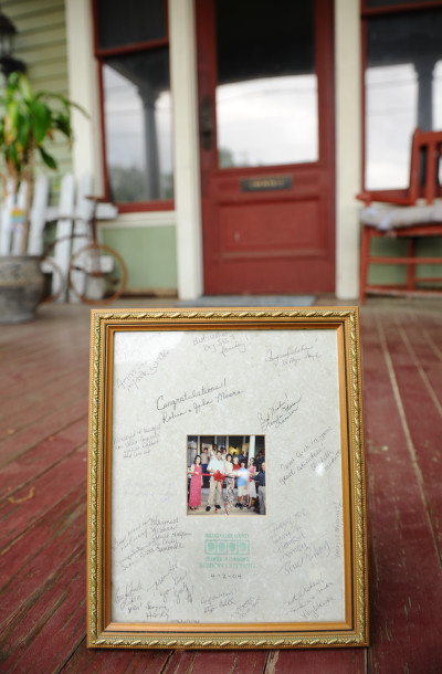 Original and signed version of our ribbon cutting picture from Chamber of Commerce. Shown now, ten years later on the front porch of our Victorian Studio located at 122 N Mound in Nacogdoches, Texas.