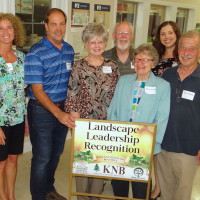 G Patterson Studio owners and volunteers pose with Katie Blevins in recognition of the Nacogdocehes Landscape Leadership Award. (Photo courtesy Nacogdoches Chamber of Commerce)