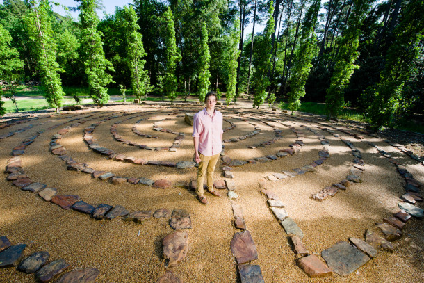 Luke Stanley surrounded by his Eagle Scout project in the SFA garden. The labyrinth was finished spring 2017.